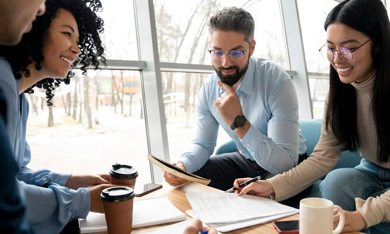 coworkers working and discussing ideas in the workplace